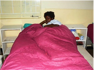 Mother and baby warm under a new blanket.